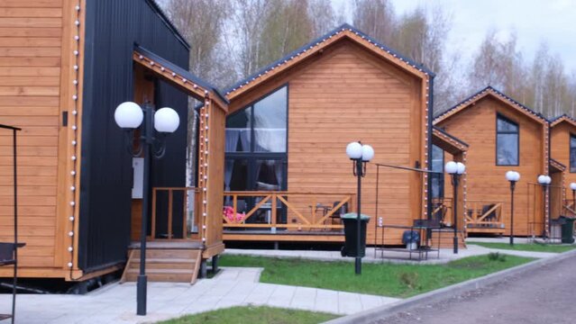 A group of houses in the same style. Trendy modern barnhouse style houses