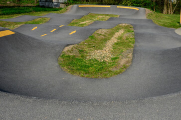 Skateboard park with concrete cement surface with concrete skateboard obstacles is designed for roller sports. Cycling is not allowed except for freestyle bikes. icing winter morning sunrise