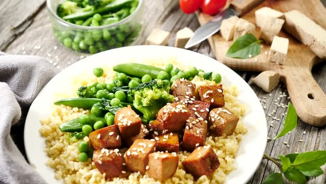 fried tofu with soy sauce and bulgur with vegetable