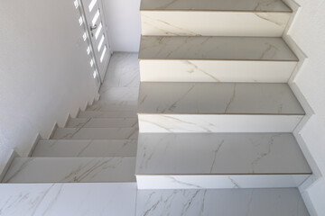 Elegant staircase with white marble steps