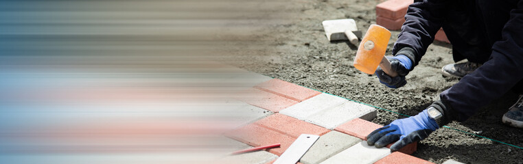 man holding hammer and stone