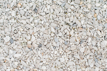 background of small white stones, light minimalistic natural background banner