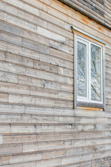 minimalistic facade of a wooden house with a window