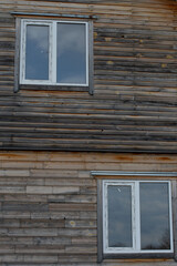 minimalistic facade of a wooden house with a window