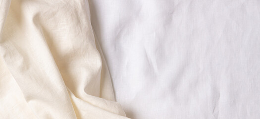 White crumpled linen fabric texture background. Natural linen organic eco textiles canvas background. Top view