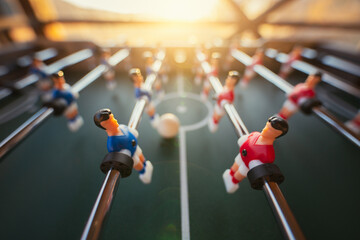Tabletop arcade retro football game in backlight sunlight.