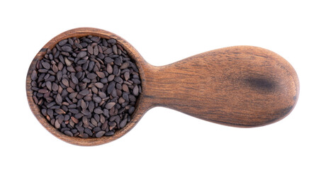 Black sesame seeds in wooden spoon, isolated on white background. Organic spice. Top view.