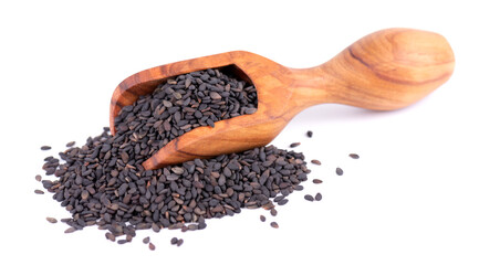 Black sesame seeds in olive scoop, isolated on white background. Organic spice.