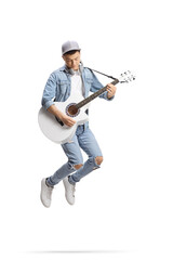 Fototapeta na wymiar Energetic guy jumping and playing an acoustic guitar