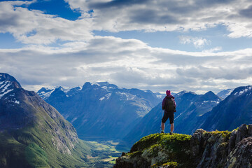 Hiker on the mountain top. Sport and active life concept