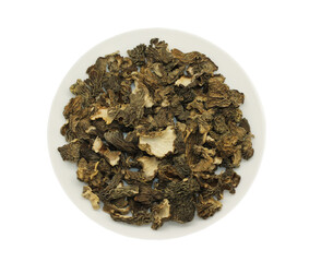 Dried spring mushrooms lie on a white plate. An isolated object. High quality photo