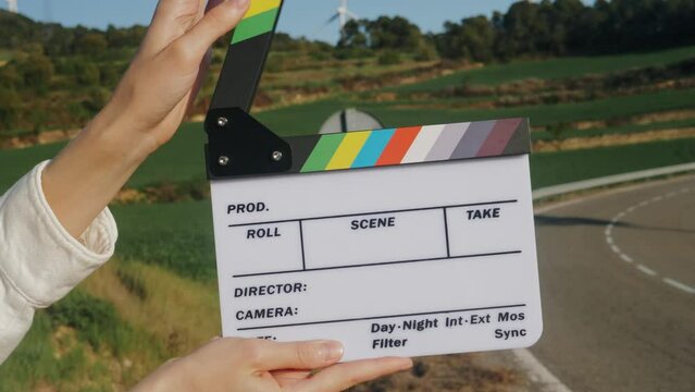 Clapperboard close-up. Movie clapper on nature background. Film production, cinematography concept. 