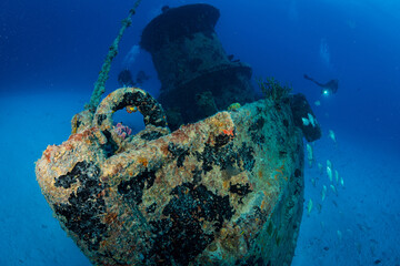 Diver on the wreck of the Porpoise off the Dutch Caribbean island of Sint Maarten