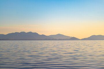 Fototapeta premium Beautiful sea, mountain, sunset and horizon view. Peaceful space.