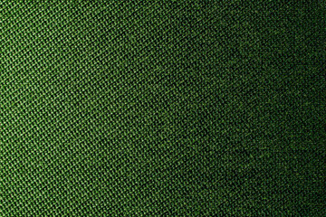 Dark green background of textile material with wicker pattern, close up. The structure of olive tissue. Fabric background
