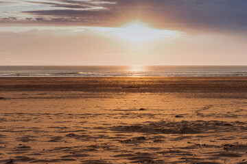 Obraz premium Golden Sunset on the beach of Woolacombe in Devon, England.
