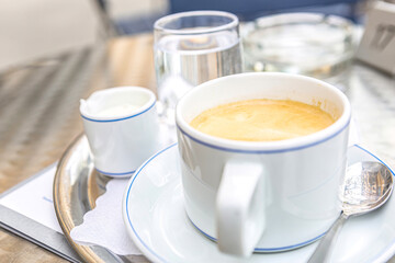 Random tourist scene: Drinking a coffee in an austrian cafe in Salzburg, europe
