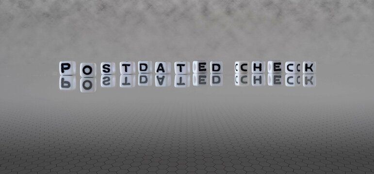 postdated check word or concept represented by black and white letter cubes on a grey horizon background stretching to infinity