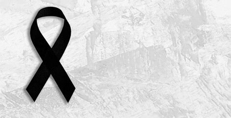 Black ribbon bow symbolizing mourning. - obrazy, fototapety, plakaty