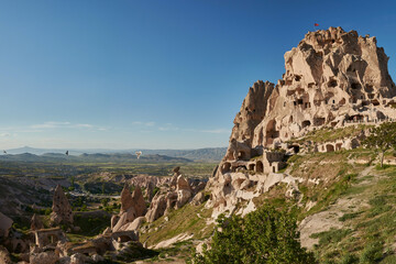 Fototapeta na wymiar Beautiful view of ancient castle-mountain Uchisar in Cappadocia,Turkey