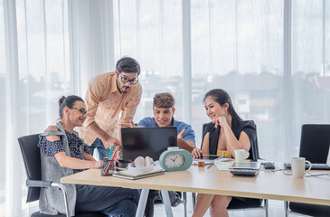 Group Of Business Colleagues Having Informal Meeting in office