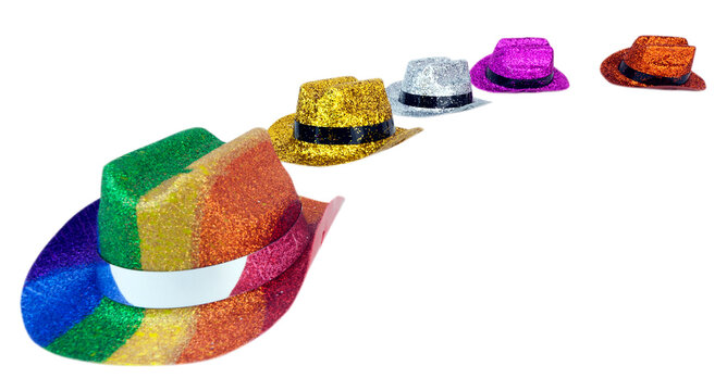 Colorful shiny glitter hats arranged in a perspective arc. Isolated. Copy space.

