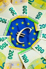 Euro exchange rate. state of the economy and currency of the EU countries. euro bills and the euro sign on the flag of the European Union.Depreciation of the euro currency