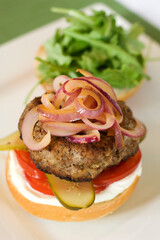 Hamburger topped with onions