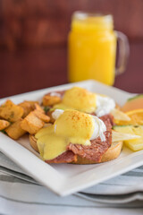 Smoked meat eggs benedict with potatoes