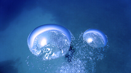 rtistic underwater photography of air bubbles going up to the surface