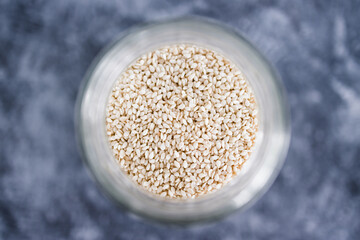 spice jar with sesame seeds close-up shot of pantry ingredients