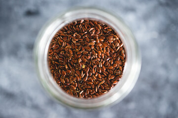 spice jar with flaxseeds close-up shot of pantry ingredients
