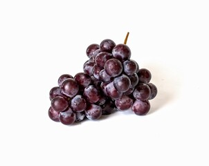 Big bunch of sweet red grapes isolated on white background.
