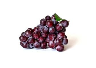 Close-up of a large bunch of red grapes, isolated on white background.