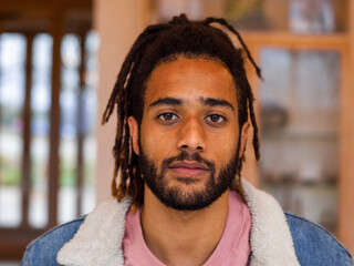 Portrait of young man with dreadlocks