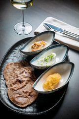 pita with different dips and white wine