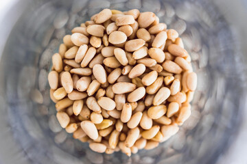 spice jar with pine nuts close-up shot of pantry ingredients