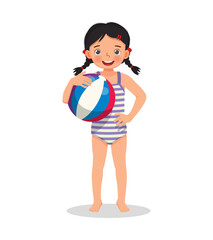 happy cute little girl with swimsuit holding inflatable beach ball with hand on waist pose having fun on summer time