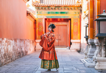 Fototapeta na wymiar Women in classical Chinese costumes in the Forbidden City