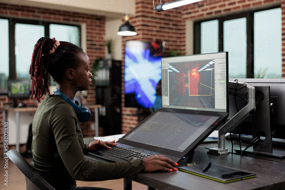 Poster production department employee developing game mechanics in order to achieve realism. game designer 