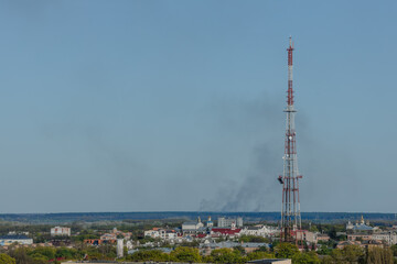 Burning building in ukrainian city Chernihiv near Kyiv on north of Ukraine. Infrastructure of city attacked by enemy aircraft troops or artilllery. War of Russia against Ukraine