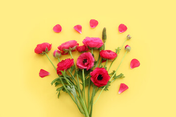 Fototapeta premium Top view image of pink flowers composition over yellow background