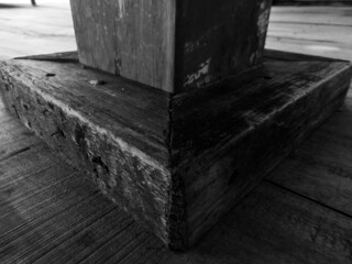 black and white photo of wooden saka to support the building