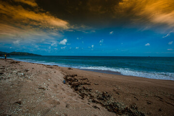 The natural background of the morning light rising in the middle of the sea and surrounded by mountains, cool breezes, the beauty of the ecology of the tourist attractions.