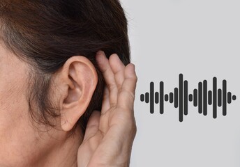 Ear of Asian woman with deafness. Concept of keeping the ears open.