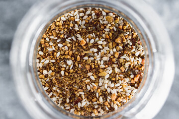 spice jar with dukkah seasoning close-up shot of pantry ingredients
