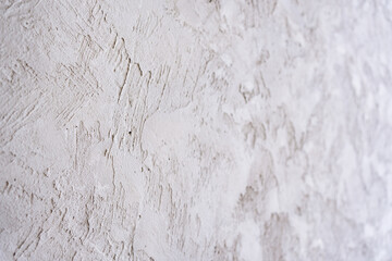 artistic plaster on a gray and white wall. Repairs. elements of wall decor. copy space. texture. background.