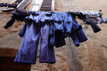 Blue work clothes hanging after washing