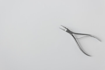 Open dental forceps for removing the root of the tooth isolated on the white background. Dental care and vet medicine.