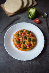 Popular Italian snack item pizza in a white plate on a background. Top view, selective focus.